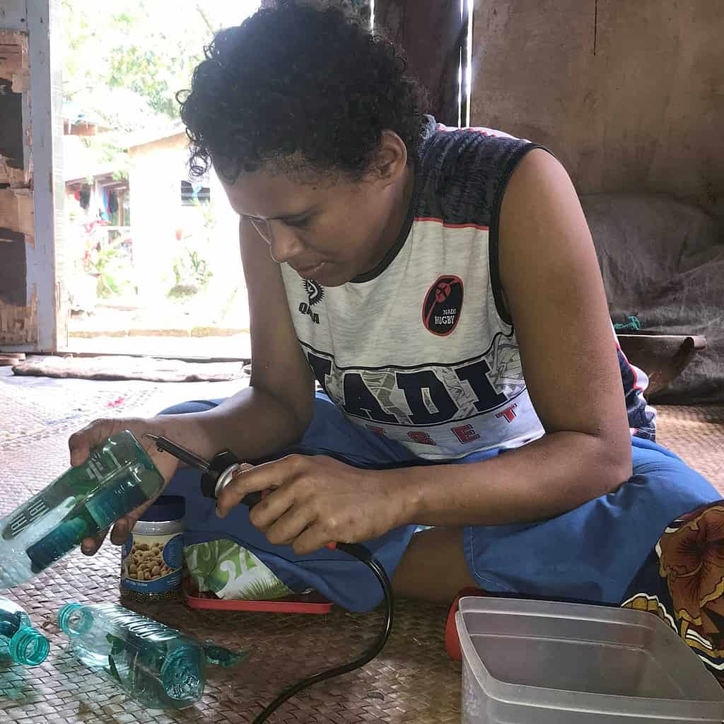 Galoa woman working with plastic