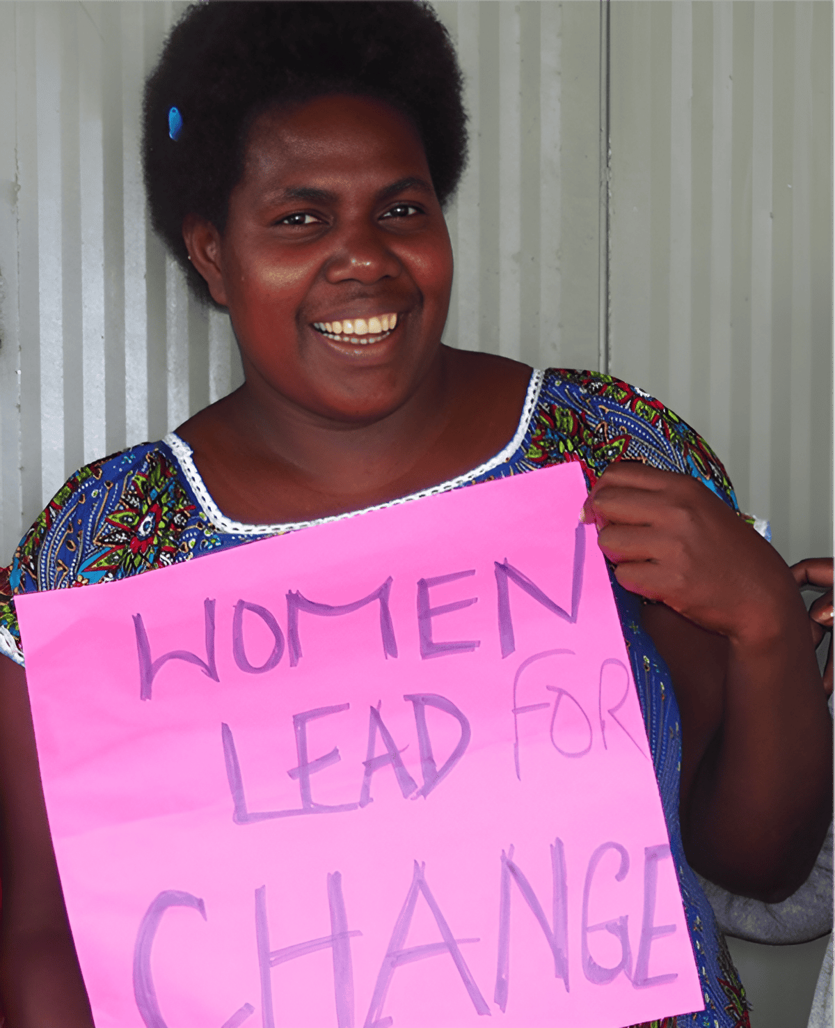Florence Naina displays the ‘Women Lead for Change’ slogan.
